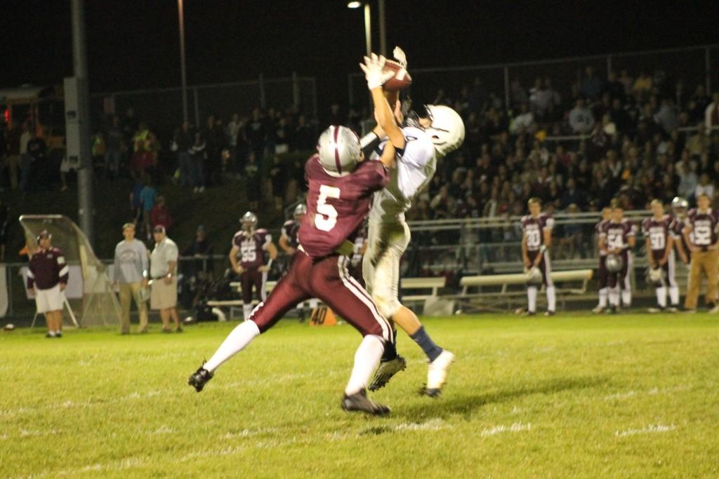 Hanselmann fights with a receiver to bring down the ball.