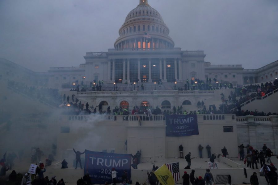 Police+officers+stand+guard+as+supporters+of+U.S.+President+Donald+Trump+gather+in+front+of+the+U.S.+Capitol+Building+in+Washington%2C+U.S.%2C+January+6%2C+2021.+REUTERS%2FLeah+Millis+++++TPX+IMAGES+OF+THE+DAY