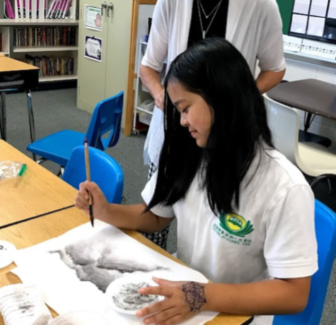 Junior Emma Chen works on a painting at her Chinese Sunday school in 2020.