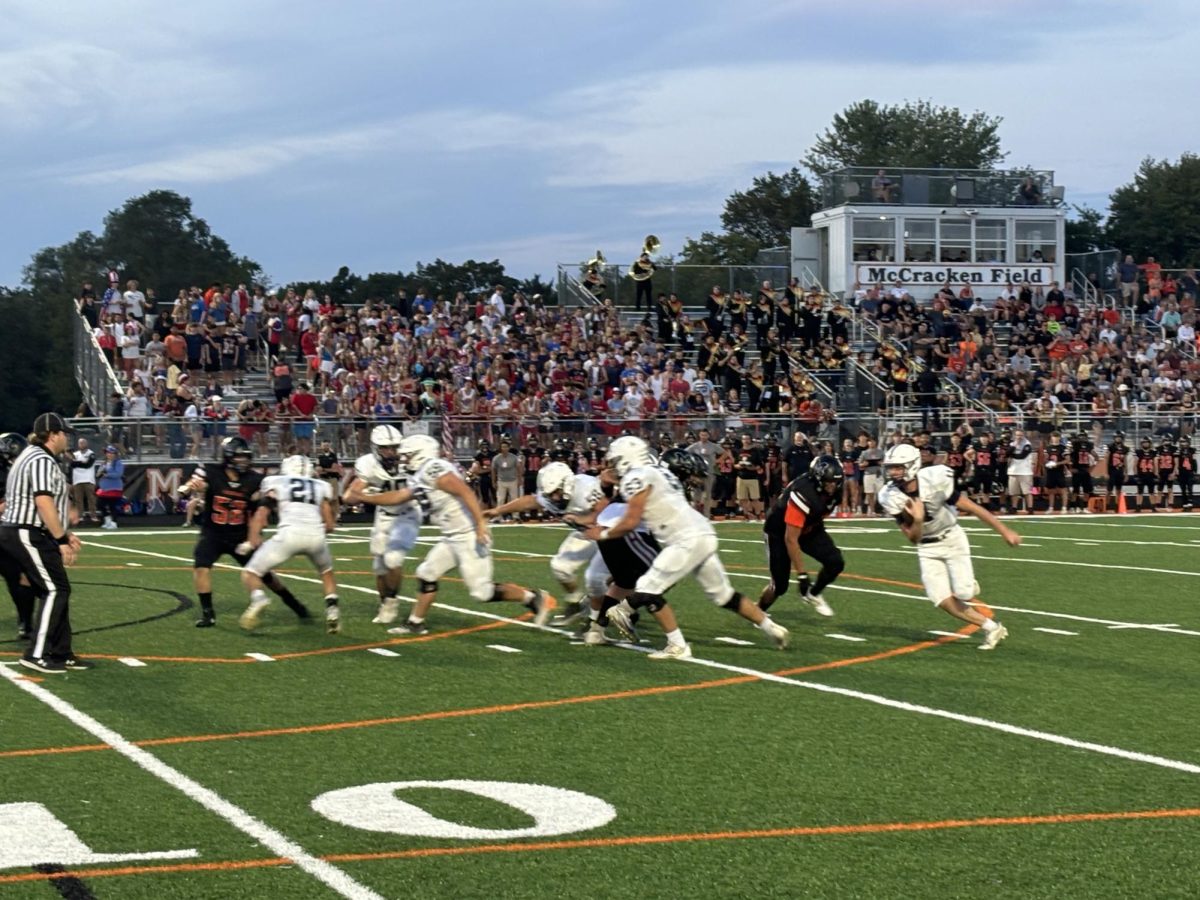 Potent offense provides Trojans with 46-7 win over McHenry